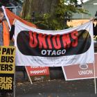 Dunedin bus passenger Umi Asaka (left), Unite Union organiser Sonja Mitchell and part-time bus...