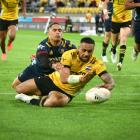 Ngani Laumape gets away from an Aaron Smith tackle to score for the Hurricanes. Photo:  Getty...
