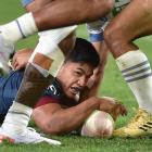 Highlanders No 15 Josh Ioane dots down for a try in the first half of their match against the...