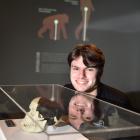 Otago Museum science communicator Quinn Hawthorne examines an exhibit from a new museum show on...
