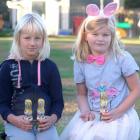 Kakanui School pupils Tilly McKnight (left) and Kate Ransby(both 7) hold some of the Easter...