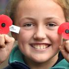 Smiling with her poppies outside the Golden Centre is Grace Slocombe (10) of Dunedin. PHOTO:...