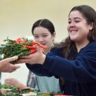 Making posies to honour Dunedin’s war veterans yesterday were Ashleigh Thompson (15, left) and...