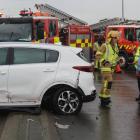 Firefighters redirect traffic at the corner of Bay and North Rds after a car spun into a traffic...