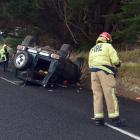 Emergency services at a vehicle roll over on Mount Grand Road about 4.45pm on Monday. PHOTO:...