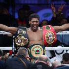 Anthony Joshua celebrates after beating Andy Ruiz to win back the heavyweight titles in his most...