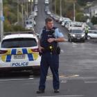 Police in North Dunedin following an alleged theft from a commercial premises. Photo: Peter McIntosh