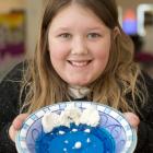 Marion McMullan holds her glacier-inspired entry at the Great Rockcake Bakeoff in Dunedin on...