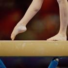 Female gymnast competes on balance beam. Photo: Getty Images
