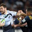 Luke Morahan tries to break the tackle of Aaron Smith when the Force played the Highlanders in...