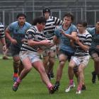 Otago Boys' held on in the second half of a wet and muddy match against rivals Kings' High. Photo...
