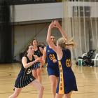 Hunting for the ball are (from left), St Hilda’s Collegiate players Grace Southby and Brooke...