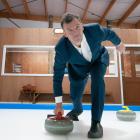 Southland MP Joseph Mooney throws a stone at the new Alexandra Curling Rink. Mr Mooney was on...