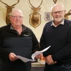  New Zealand Deerstalkers Association North Otago president David Hay (left) and hut project co...