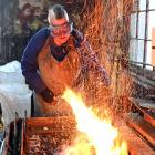 Dunedin builder and blacksmith Peter Mason operates a forge at the Dunedin Gasworks on Saturday,...