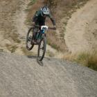 A mountain biker lands a jump while competing at Signal Hill in February. PHOTO: THE STAR FILES