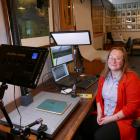 New Clutha Libraries community heritage co-ordinator Tiffany Jenks digitally archives a vintage...