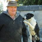 Mark Copland at home on farm with Don, after a successful dog trial season.