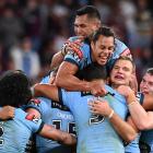 New South Wales players celebrate their victory over Queensland. Photo: Getty Images