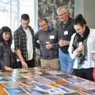 Judging the Otago Museum Photography Competition yesterday are (from left) Shanaya Cunningham, of...