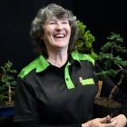 Diacks Nurseries garden assistant Fionna Burgess shows her bonsai at the Southland Home Show on...