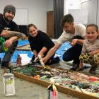 Quenton Nankivell (left) took his daughters, Wikitori (10) and Mihiana (7), to help local artist...
