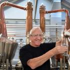 Cyril Yates stands in front of the New Zealand Whisky Collection's stills at Speight’s Brewery in...