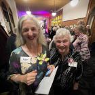Association of University Women president Shirley Gillett (left) and Lorraine Isaacs catch up at...