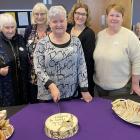 Cutting the cake to mark 15 years of the Brain Injury Otago service on Tuesday are (from left)...