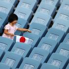 A young girl watches the women’s football pool match between the Football Ferns and Sweden this...
