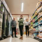 Alexandra Discounter staff Murray Warburton, manager Jessie Zhou and Talya Reid on the first day...