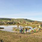 Pupils and teachers from Heriot School take part in a wetland planting day on Ardmore Rd, Heriot,...