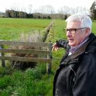 Otago South River Care project manager Lloyd McCall  inspects a dairy paddock 
...