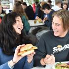 Enjoying a meat-free schnitzel at Aquinas College yesterday are sub-warden Sara Aruquipa and...