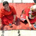 Applying motifs yesterday to a Tongan tapa cloth, for one of many cultural presentations at the...