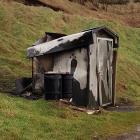 The public toilet in rural Southland’s Cosy Nook cove was burned down. Photo: Supplied