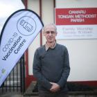Dr Jon Scott, standing outside Central Medical’s new Covid-19 vaccine clinic in Eden St, is...