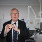 University of Otago Health Sciences Pro-Vice-Chancellor Professor Paul Brunton with the weight...