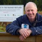 Waipahi Wetland project manager Shane Bocock rests on a gate at the wetland in South Otago last...