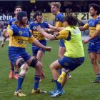 Taieri celebrate their win over Green Island in the Dunedin Premier rugby final at Forsyth Barr...