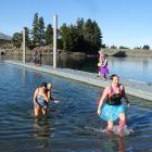 Emerging from the 9degC water at the Lake Hawea boat ramp jetty after their polar plunge...