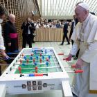 Pope Francis plays table football during his weekly general audience in the Vatican. PHOTOS:...