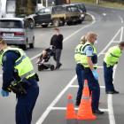 Police stop traffic in Portobello in Covid-19 Alert Level 4 yesterday. Senior Constable Aaron...
