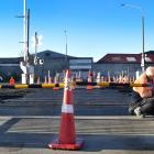 Safety gates are being installed at the St Andrew St rail crossing in Dunedin as part of an...