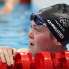 Dunedin swimmer Erika Fairweather looks up in shock as she realises she has broken a New Zealand...