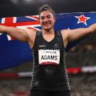 New Zealand shot putter Lisa Adams celebrates after winning gold at the Tokyo 2020 Paralympic...