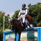 Robin Godel of Team Switzerland riding Jet Set clears a jump during the Eventing Cross Country...