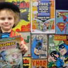 Tate Feaver (5) happily shows the comic book he won at the Free Comic Book day at Invercargill...