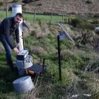 AgResearch Invermay senior scientist Richard Muirhead programmes an automatic water sampler in a...