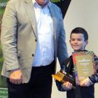 Sawyers Bay School pupil Hunter Swete (10) accepts the Dunedin Amenities Society Best School...